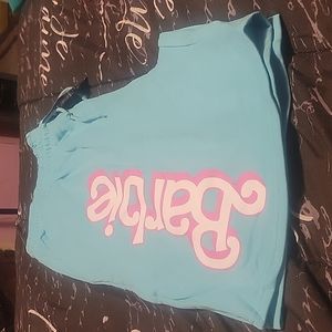 Blue shorts with barbie on them